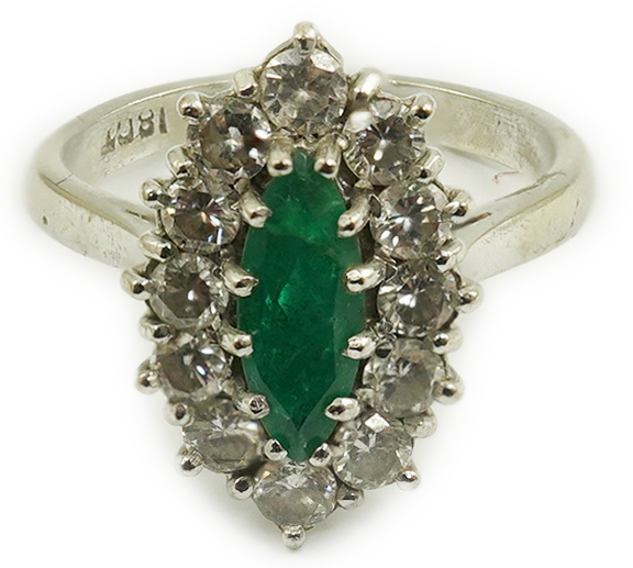 A modern 18ct white gold and single stone marquise cut emerald set ring, bordered with round brilliant cut diamonds